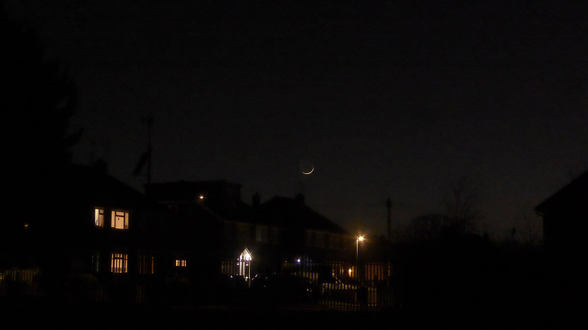 The One-Day-Old Moon Above the Rooftops - 30 Mar 2025