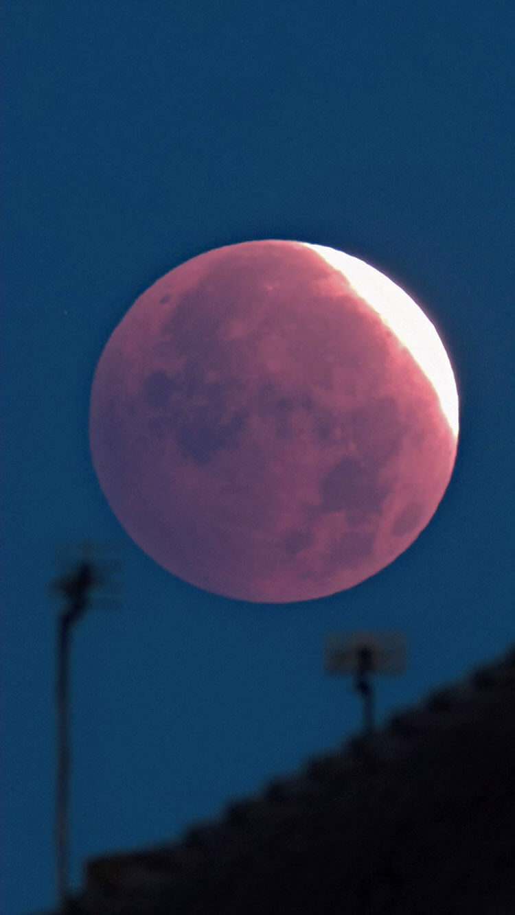 Moon Above Roofs - Partial Lunar Eclipse - 28 Aug 2026